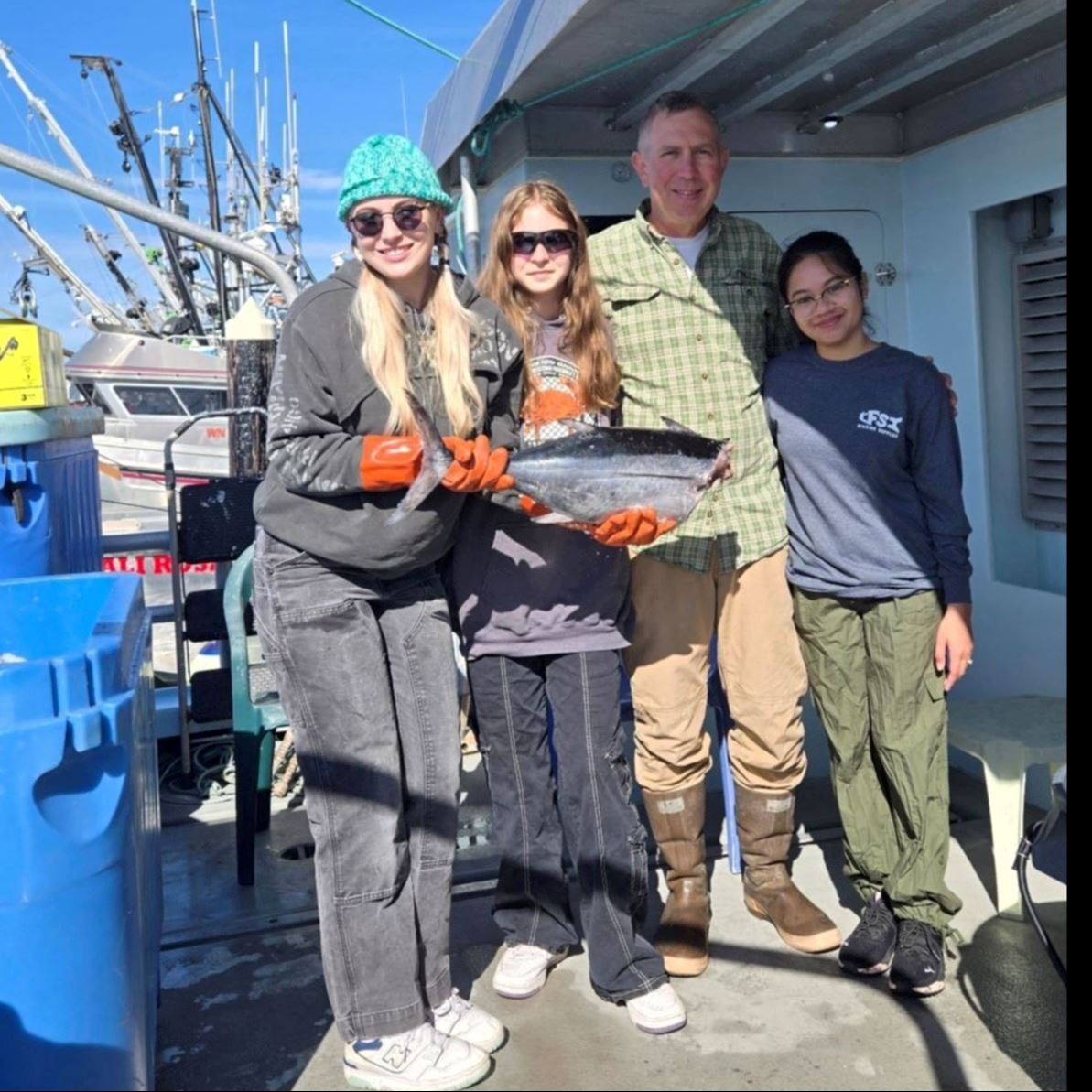 fishing family aboard their vessel
