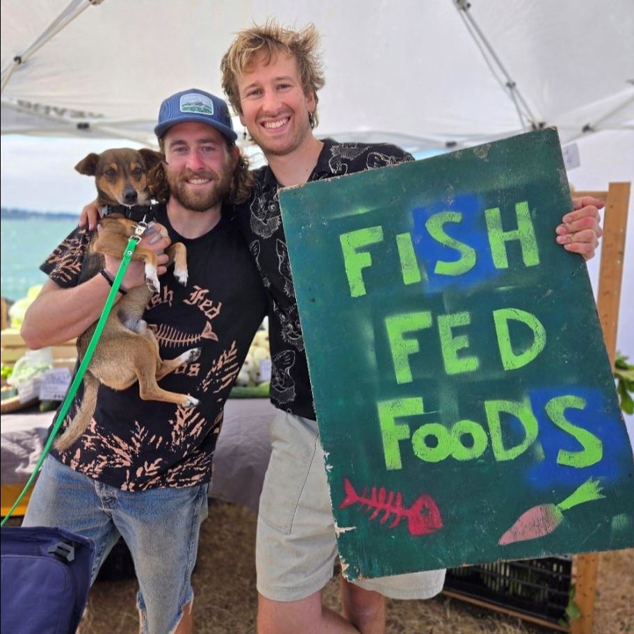 Fish Fed foods hold their sign