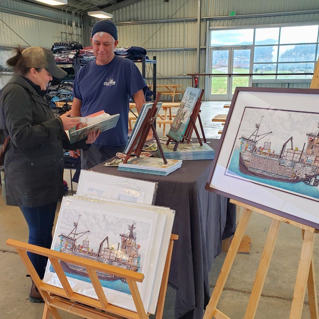 Tom Crestodina of The Scow looking at a book with his customer